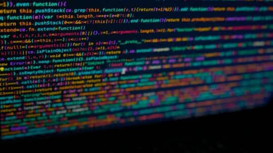 Colorful computer code displayed on a screen, representing API documentation, software development, programming, and application programming interface technology.
