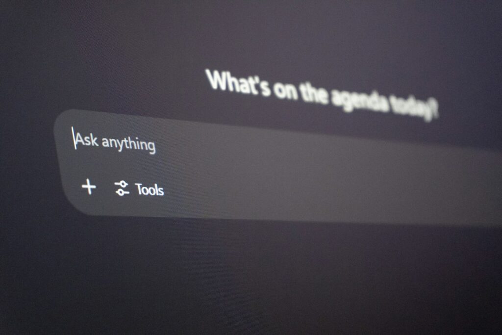 Close-up of a ChatGPT prompt box on a dark screen, showing “Ask anything” and a Tools button.