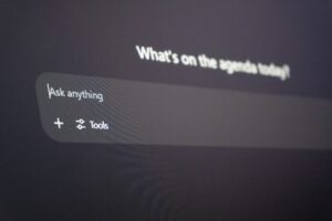 Close-up of a ChatGPT prompt box on a dark screen, showing “Ask anything” and a Tools button.